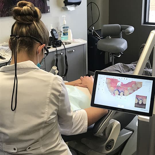 Dr. Krysta Sellers, a dentist in Bismarck, ND, using the 3Shape Trios Scanner on a patient