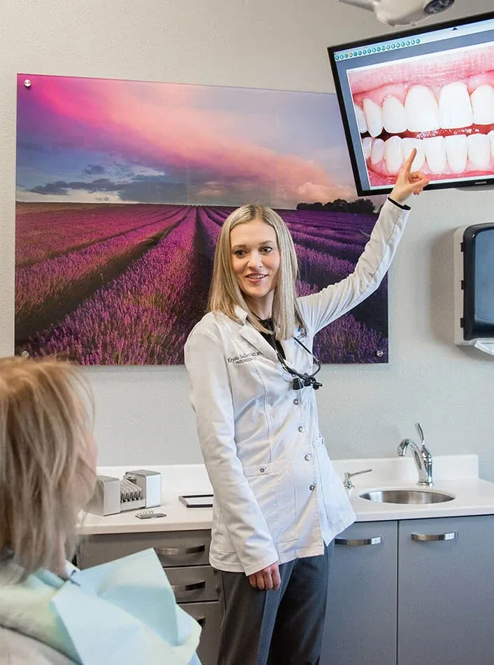 Dr. Krysta Sellers Explaining A Dental Procedure to a Patient
