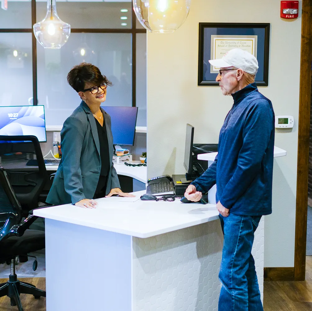 Recepcionist receiving a new patient
