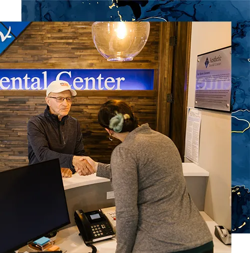 Font Desk Manager Shaking Hands With New Patient