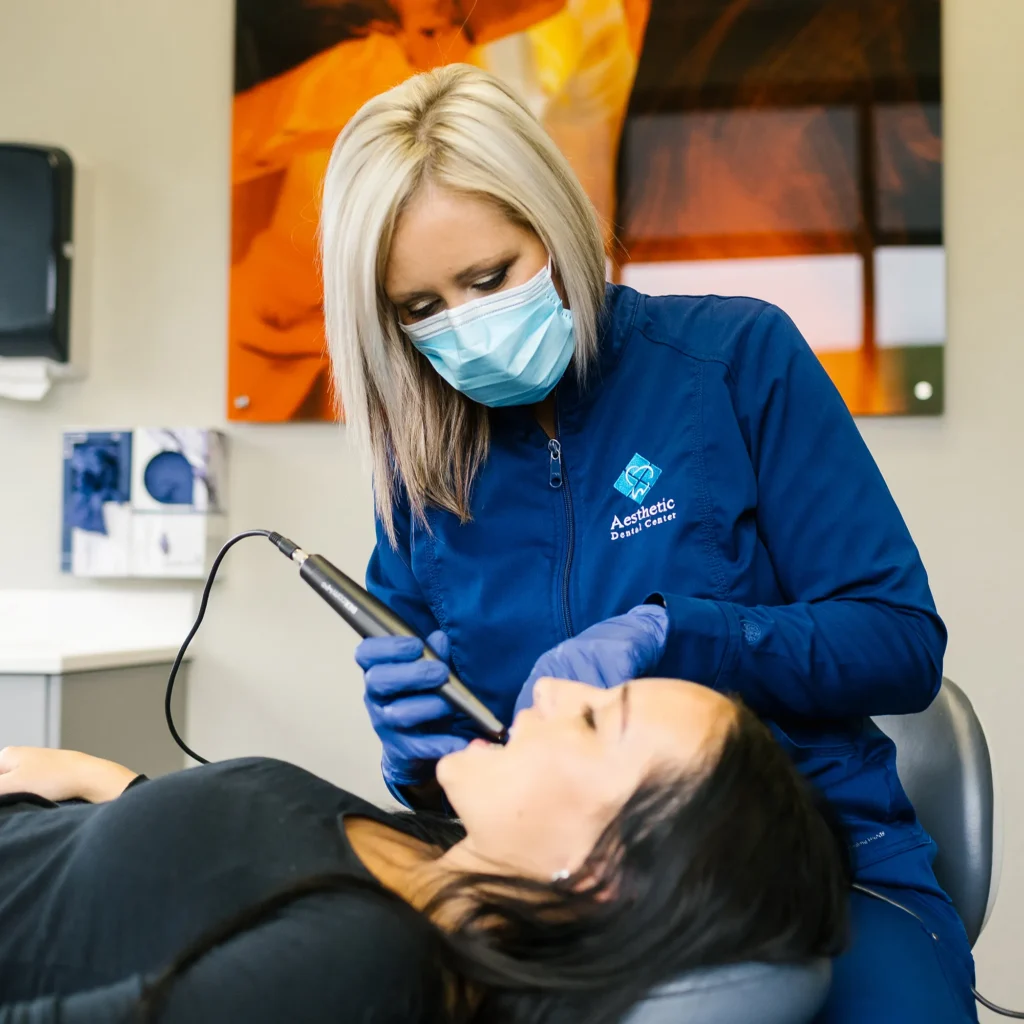 Dental Hygienist Using Laser