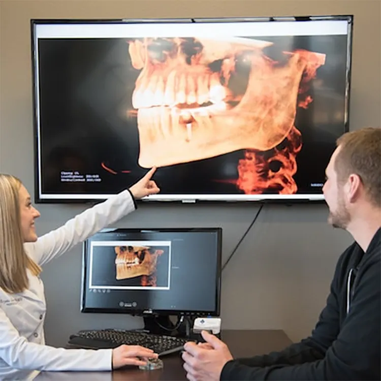 Dr. Sellers Pointing to X-Rays