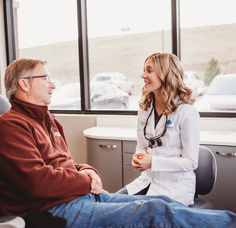 Dr. Sellers Talking To Patient About Dental Crowns